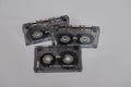 Three vintage used music cassettes plastic bands