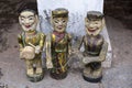 Three vintage Vietnamese hand-painted wooden statues