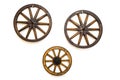 Three vintage wagon wheels on white wall Royalty Free Stock Photo