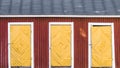 Three vintage yellow doors in a red wooden house