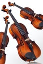 Three violins on white background