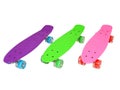 Three vivid colored skateboards isolated on white