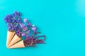 Three waffle cones with flowers blossom bouquets on blue surface Royalty Free Stock Photo