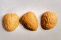 Three walnut shells for a shell game Royalty Free Stock Photo