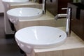 Three of wash basins and faucets Royalty Free Stock Photo