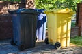Three waste bins for mixed waste are in the yard Royalty Free Stock Photo