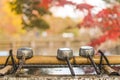 three water ladles on purification basin in the inokashira park of Kichijoji city in autumn Royalty Free Stock Photo