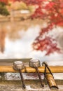 Three water ladles on purification basin in the inokashira park of Kichijoji city in autumn Royalty Free Stock Photo