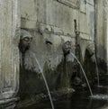 Three waterspouts in a stone memorial in the town of Ston, Dubrovnik - Neretva, Croatia Royalty Free Stock Photo