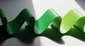Wavy Ribbons in Graduated Shades of Green with Dramatic Shadows and Light Rays green ribbons Royalty Free Stock Photo