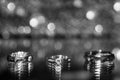 Three wedding rings on the reflecting surface with highlights