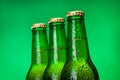 Three wet blank beer bottles