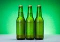 Three wet blank beer bottles