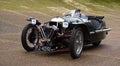 Three wheel Morgan Super sports car on Brooklands racetrack. Surrey, England. Royalty Free Stock Photo