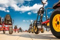 Three-wheeled bike cars are in the Park on the asphalt Royalty Free Stock Photo