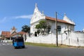 A three-wheeler passing by the Groote Kerk or Dutch Reformed Church within the Galle Fort