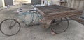 A three wheeler trolly loaded with steel frames for shifting in India, transportation inside construction site. Royalty Free Stock Photo