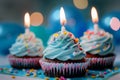 Three Magical Cupcakes With Blue Frosting and Sprinkles Royalty Free Stock Photo