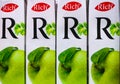 Three white boxes of rich apple juice stand on a counter in a store at the address Russian Federation Kazan city 88 Spartakovskaya