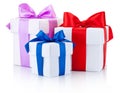 Three White boxs tied with colored satin ribbons bow Isolated Royalty Free Stock Photo