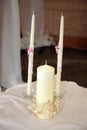 Three white candles for the wedding ceremony