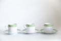 Three ceramic cup on white backdrop Royalty Free Stock Photo