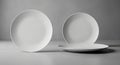 Three White Ceramic Plates Arranged on a Textured Surface dish tableware Royalty Free Stock Photo