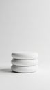 Three white circles stacked on white background Royalty Free Stock Photo