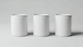 Three White Cylindrical Containers in a Row Royalty Free Stock Photo
