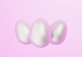 Three white easter eggs on light pink background Royalty Free Stock Photo