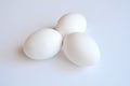 Three white eggs on a white background Royalty Free Stock Photo