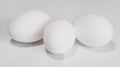 Three white eggs on white background Royalty Free Stock Photo