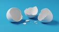 Minimalist Broken Eggshells on Vibrant Blue Background Royalty Free Stock Photo