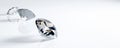 Three White Faceted Diamonds at Various Angles on white background. copy space. wide web banner