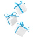 three white gift boxes with blue bows Royalty Free Stock Photo