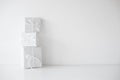Three white gift boxes packages with ribbons on table Royalty Free Stock Photo