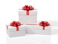 Three White Gift Boxes With Red Bow.