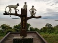 Three white monkeys sculpture with sea background