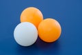 Three White and orange ping pong ball Royalty Free Stock Photo