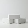 Three white rectangular blocks are stacked on a white background. Two blocks form Royalty Free Stock Photo