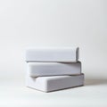 Three white rectangular blocks are stacked unevenly against a plain white Royalty Free Stock Photo