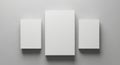Three white rectangular boxes arranged creatively on a textured surface Royalty Free Stock Photo