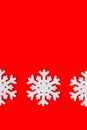 Three white snowflakes on a red background Royalty Free Stock Photo