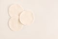 Three white sponges to clean skin or makeup removing. Cosmetology or skincare concept. Light blank background with copy space