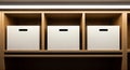 Three white storage boxes with handles on wooden shelves Royalty Free Stock Photo