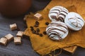 Three white tender cake with a spoon on a vintage wooden background. Selective focus, close up Royalty Free Stock Photo