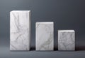 Three White Textured Pedestals of Varying Heights on a Smooth Gray Background Royalty Free Stock Photo
