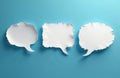 Three white torn paper speech bubbles on blue background. Empty bubbles for dialogue message. Communication concept with blank Royalty Free Stock Photo