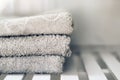 White towels piled in a sink. Royalty Free Stock Photo