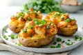 Three whole baked potatoes in jacket stuffed with chicken, green onions and cheddar cheese on plate on white background Royalty Free Stock Photo